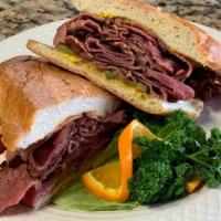 Pastrami  · Smoked pastrami with mustard and pickles on a toasted french roll