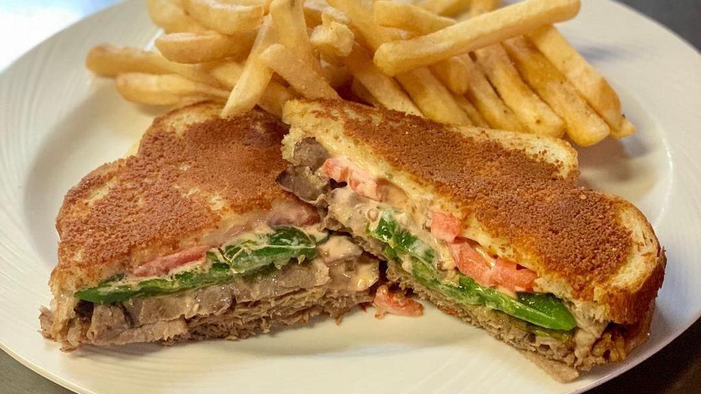 San Francisco Roast Beef Melt · Cooked in house roast beef on sourdough dipped in parmesan cheese spread with our 1000 Island dressing, grilled jalapeno, pepper jack cheese, and tomato.
