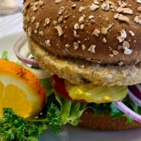 Garden Burger · 3.4 oz vegetarian patty On a wheat bun, with mayo,green leaf  lettuce, tomatoes,red onions, ...