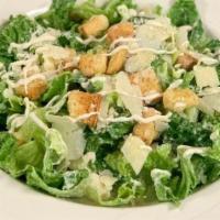 Caesar Salad · Romaine lettuce,croutons,shaved parmesan cheese.