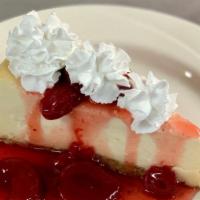 Baked New York Cheesecake Slice · Creamy baked cheesecake on a buttery graham cracker crust