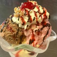 Ice Cream Sundae · Neapolitan Style (Vanilla, Chocolate, and Strawberry) Sundae topped with whipped cream, choc...