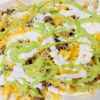 Carne Asada Fries · Carne Asada with French Fries topped with Guacamole, sour cream, and cheese.