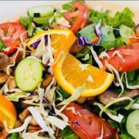 Pollo Asado Salad · Iceberg Lettuce, Romaine Lettuce, Cabbage, Shredded Carrots, Sliced Cucumbers, Tomatoes, Ora...