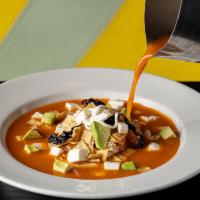 Tortilla Soup · Served with avocado, cheese, sour cream, and chile pasilla.
