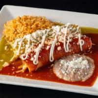 Enchiladas · Two corn tortillas filled with chicken or veggies. Topped with green, red or mole sauce, cre...
