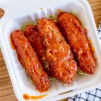 Buffalo 'Wings' · Five crispy 'chicken' tenders dipped in Buffalo sauce. Includes two sauces of your choice on...