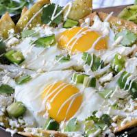 New! Chilaquiles Verdes · Corn tortilla dipped  in delicious green salsa with two over easy eggs, avocado, cheese, pep...