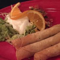 Taquitos (3) · Three shredded beef or chicken taquitos, served with avocado sauce, sour cream and pico de g...