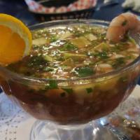 Shrimp Cocktail · A Mexican style shrimp cocktail mixed with tomatoes, diced cucumbers, onions and cilantro. T...