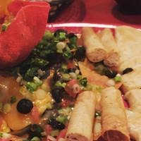 Fiesta Platter · A combo of cheese nachos, cheese quesadilla and chicken taquitos. Includes black beans, blac...