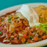Burrito De Chile Verde · Lean pork simmered in green chile sauce , filled with refried beans. Topped with green chile...