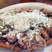 Carnitas · Slow cooked pulled pork.