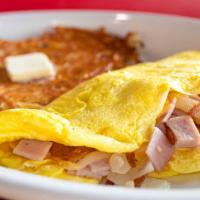 Farmer’S Omelette · American cheese, diced ham, onion, and shredded potatoes.