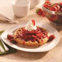 Strawberry Belgian Waffle · A freshly made Belgian waffle topped with fresh-sliced strawberries, strawberry topping, and...