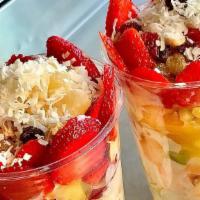 Escamochas · Fresh cut fruit mixed with our special sweet cream and orange juice. Topped with granola and...