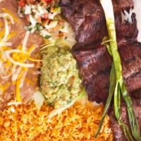 Carne Asada · Includes rice and beans.