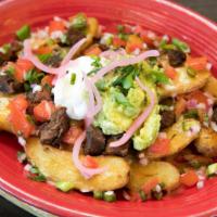 Asada Papas · Premium cut asada, potatoes, guacamole, cheese,  pico de gallo & sour cream.