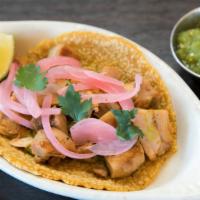 Pollo Taco · Chicken, cilantro, guacamole, pickled onion.