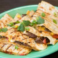 Asada Quesadilla · Premium cut asada, grilled onion, cheddar, cilantro, queso fresco, roasted corn, red pepper.