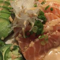 Tataki Special · Tuna or salmon. Seared fish with miso sauce, avocado, jalapeño, onion.