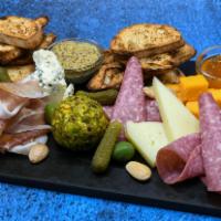 Charcuterie Board · Artisanal cheeses, selected meats, accouterments. Contains nuts.