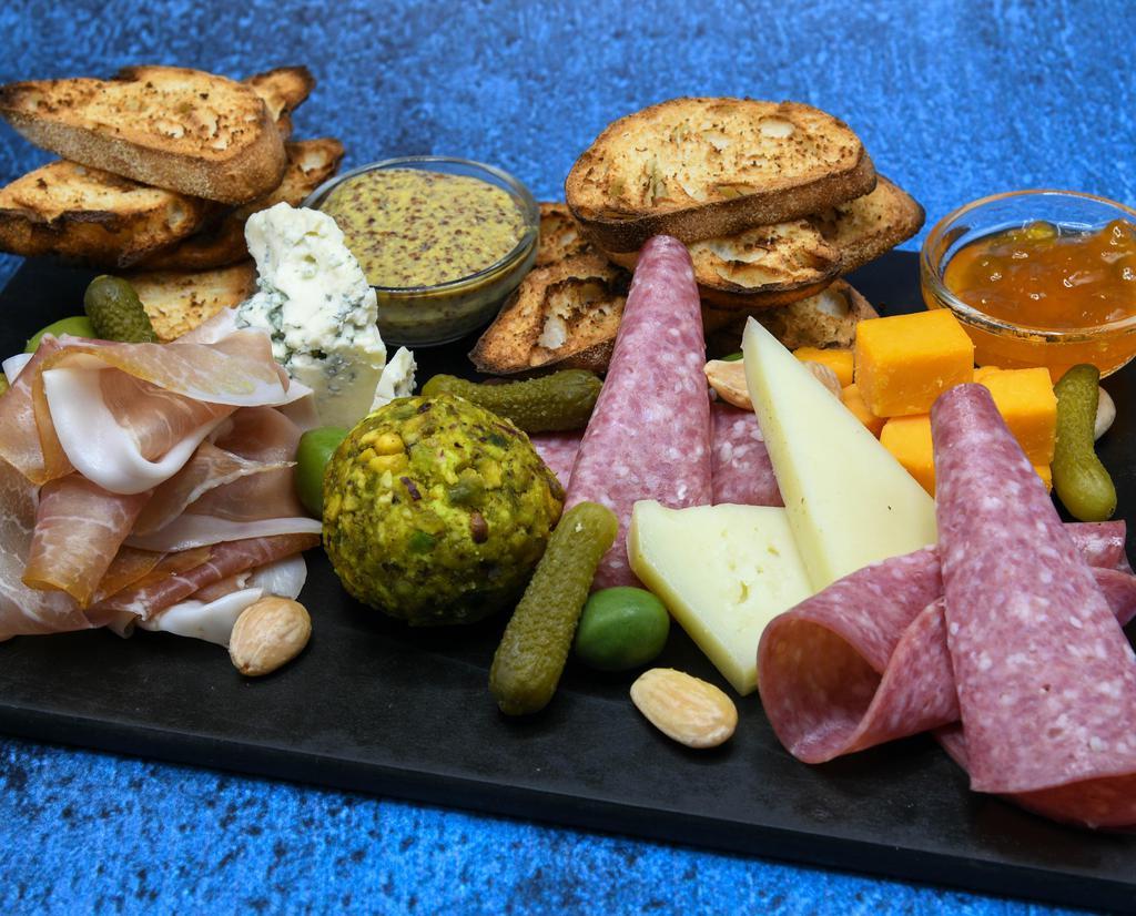 Charcuterie Board · Artisanal cheeses, selected meats, accouterments. Contains nuts.
