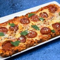 Roasted Tomato & Pepperoni Flatbread · Mozzarella, Parmesan, pepperoni, roasted tomato sauce.