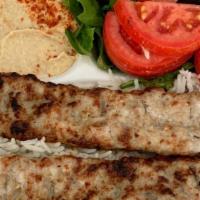 Chicken Lule Kabob · Handcrafted ground chicken lule cooked over an open fire on skewers.