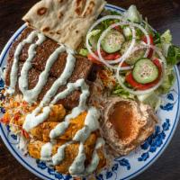 Combo Plate · Chicken and gyro over long-grained basmati rice with tzatziki, tahini sauces, and side of sa...