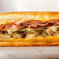 The Cuban Sandwich · Tender carnitas, ham, Swiss, pickles & Cuban mustard sauce. 640 Cal