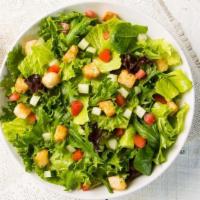 Side House Salad · A side serving of our house salad - freshly chopped romaine lettuce, Roma tomatoes, cucumber...