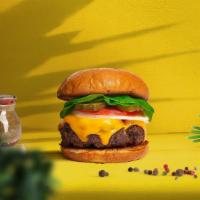 Vegan Cheese Burger · Seasoned plant-based patty topped with melted vegan cheese, lettuce, tomato, onion, and pick...