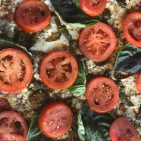 Sacratomato · Local Sliced Tomatoes, Feta, Hot Peppers, Basil, Red Sauce, Pesto & Mozzarella