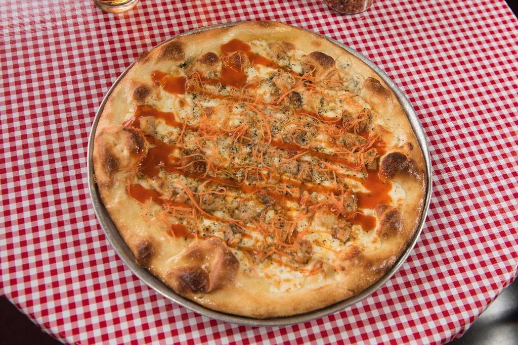 Tahoe Red · Roasted Chicken tossed in Buffalo Sauce, Blue Cheese, grated Carrots after, White Sauce & Buffalo