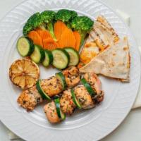 Salmon Kebab Plate · Grilled salmon, marinated with parsley, cilantro, oil, lemon juice, garlic, spices, and salt...