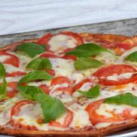 Margherita · Plum tomato sauce with fresh mozzarella & basil.