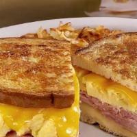 Sourdough Breakfast Sandwich · Ham, scrambled egg, and melted cheese on sourdough.