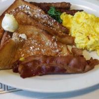 French Toast Combo · Four halves, two eggs, two bacon strips or two sausage links.