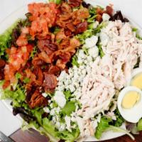 Cobb Salad · Sliced oven-roasted turkey diced bacon tomatoes sliced hard-boiled egg and blue cheese crumb...