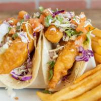 Sea Salt Tacos (Fish) With Fries · Sea Salt Tacos (Fish)
2 Fish Tacos topped with red and green Cabbage, Pico De Gallo, poppy s...