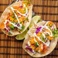Baja Style Fish Tacos · corn tortilla, shredded cabbage, sour cream, pico de gallo and chipotle mayo.