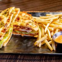 Chipotle Chicken Sandwich · focaccia bread, grilled chicken, housemade chipotle sauce, lettuce, tomato, grilled onions.