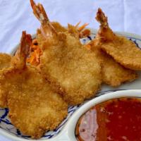 Butterfly Shrimp · Golden-fried jumbo shrimp with sweet chili dip