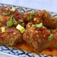 Party Wings · Fried chicken wings in house-made wing sauce