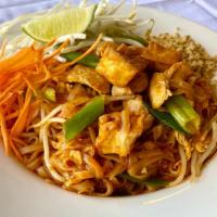 Pad Thai · Fresh rice noodles, egg, tofu, & bean sprouts in tangy tamarind sauce. Served with side of g...