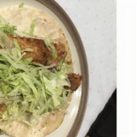 Fish Taco · Lightly battered white fish with lettuce, pico de gallo & sour cream.