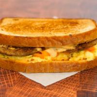 Sourdough, Sausage, Egg, & Cheddar Sandwich · 2 scrambled eggs, melted Cheddar cheese, breakfast sausage, and Sriracha aioli on buttery to...