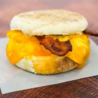 English Muffin, Bacon, Egg, & Cheddar Sandwich · 2 scrambled eggs, melted Cheddar cheese, smoked bacon, and Sriracha aioli on a toasted Engli...