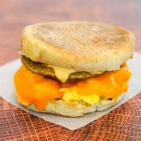 English Muffin, Sausage, Egg, & Cheddar Sandwich · 2 scrambled eggs, melted Cheddar cheese, breakfast sausage, and Sriracha aioli on a toasted ...